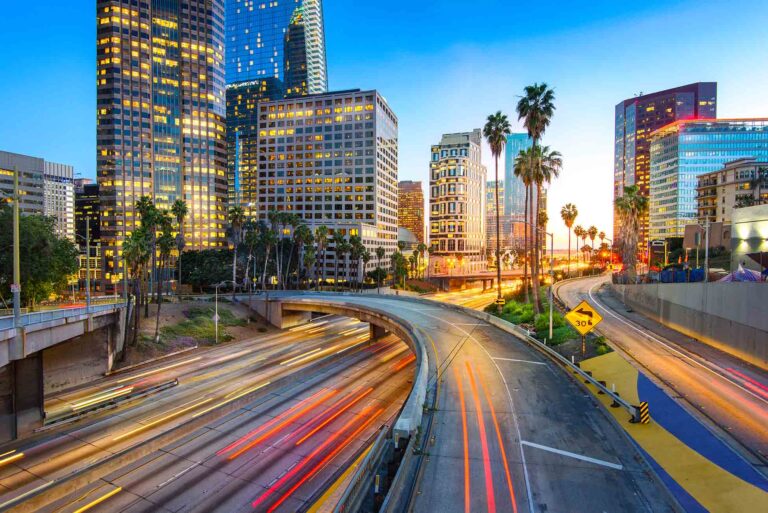 Downtown Los Angeles at sunset with car traffic light trails